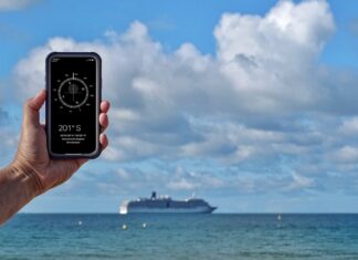 compass-on-phone-with-ship-in-background-f9d34189